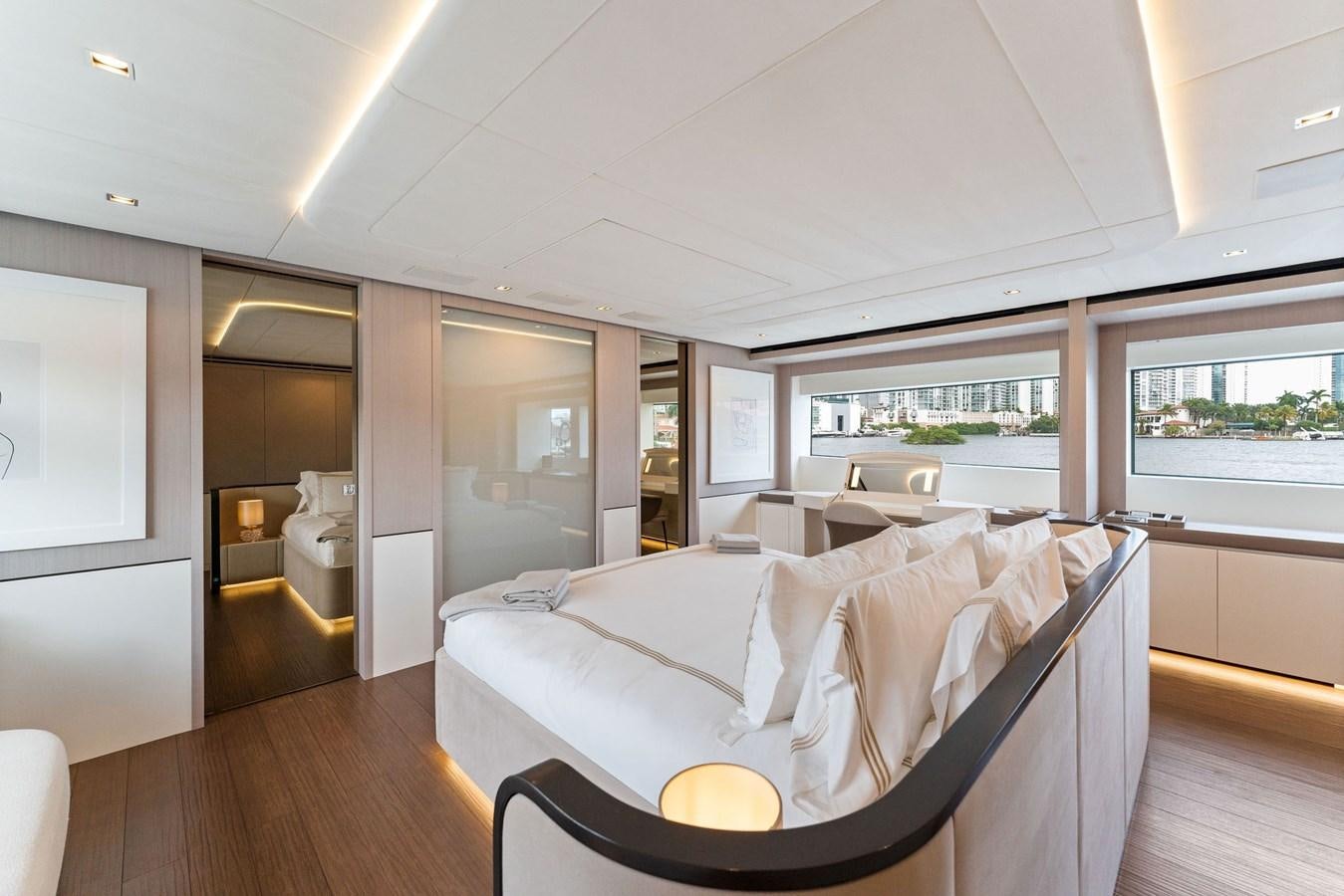 a room with a bed and a window aboard LADY K Yacht for Sale