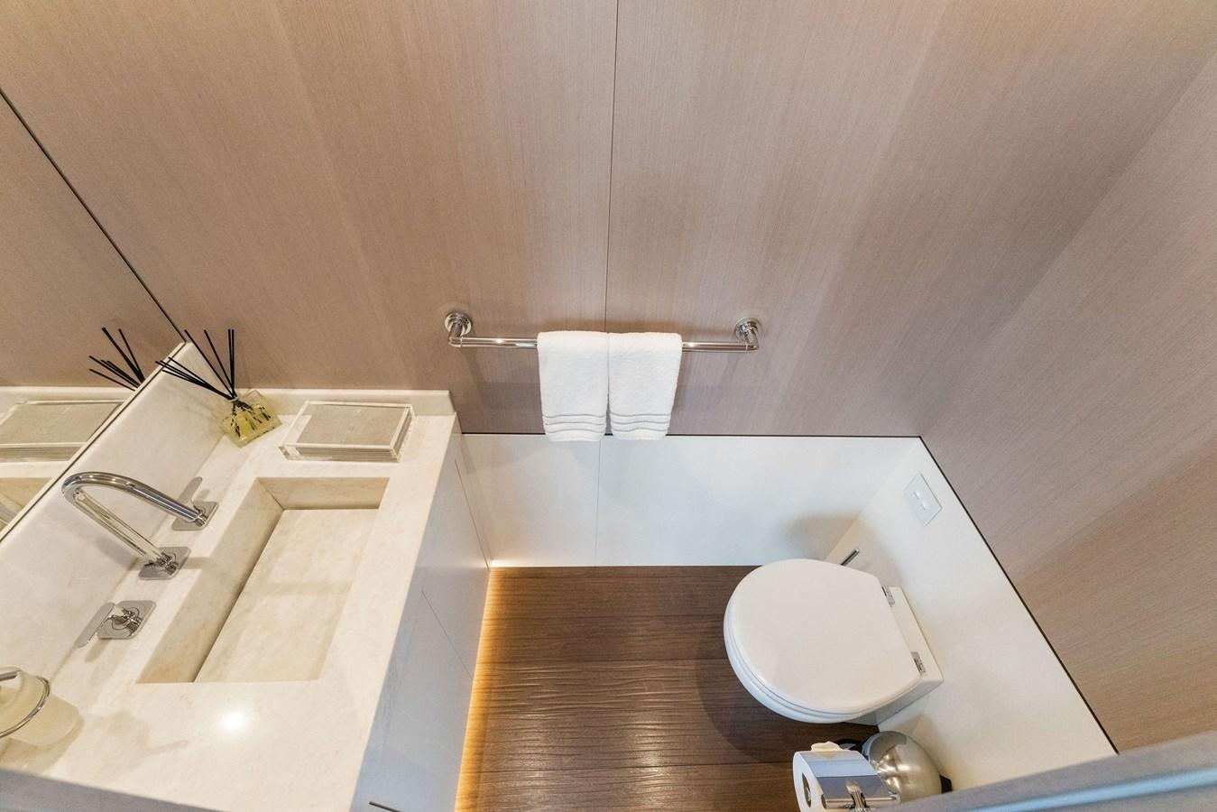 a bathroom with a wood floor aboard LADY K Yacht for Sale