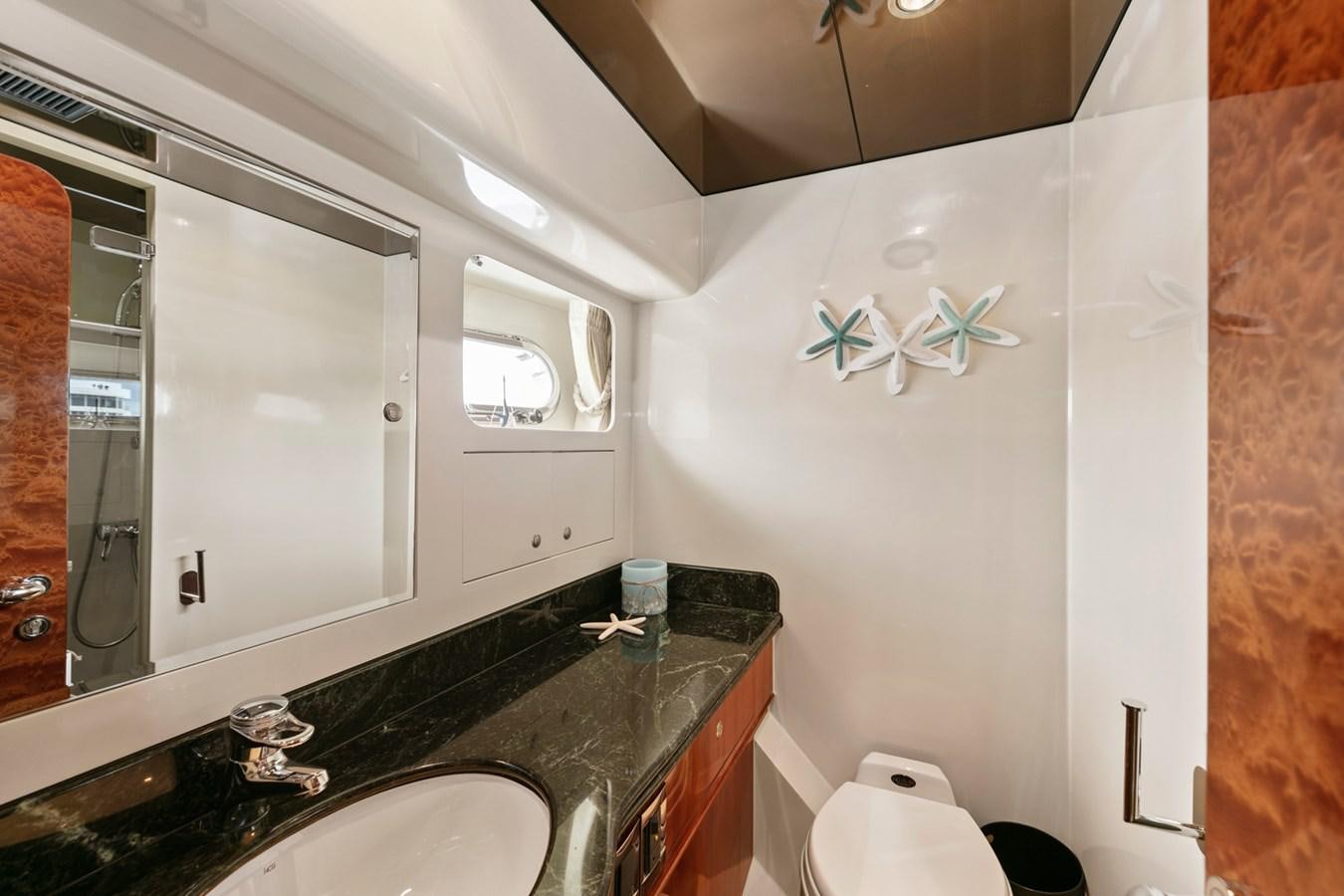 a bathroom with a large mirror aboard VAMOS A VER Yacht for Sale