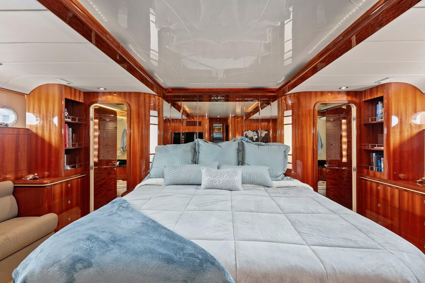 a bed with a blue sheet aboard VAMOS A VER Yacht for Sale