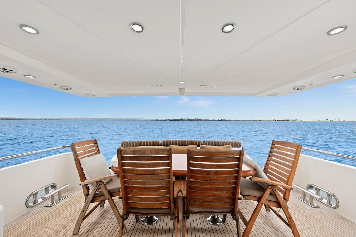 a table and chairs on a boat aboard VAMOS A VER Yacht for Sale