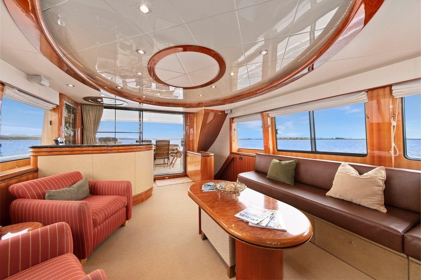 a living room with a large window aboard VAMOS A VER Yacht for Sale