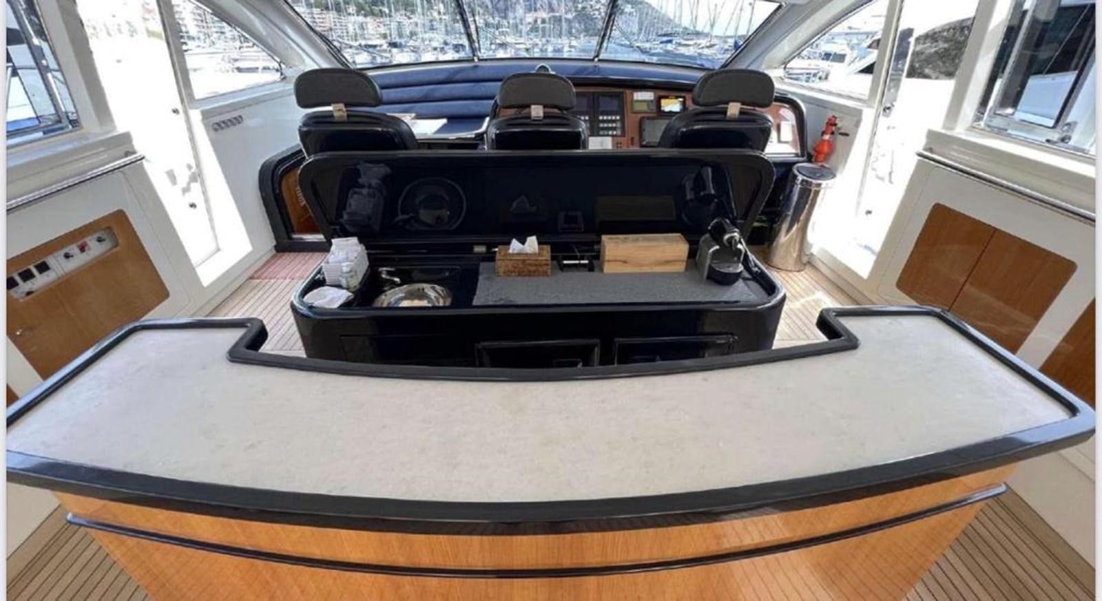 a black and white photo of a black printer on a table aboard DG Yacht for Sale
