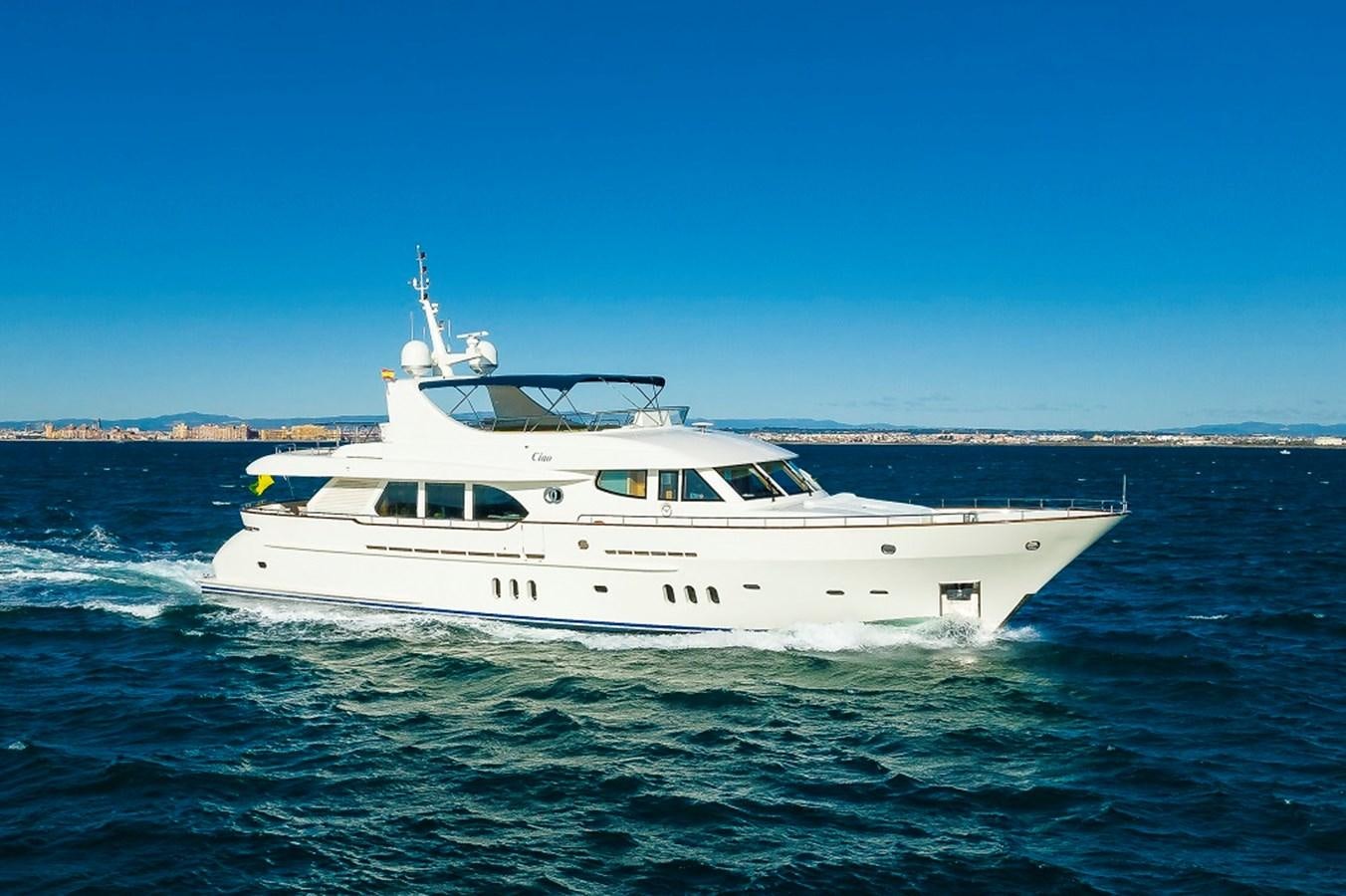 a white boat on the water aboard CIAO Yacht for Sale