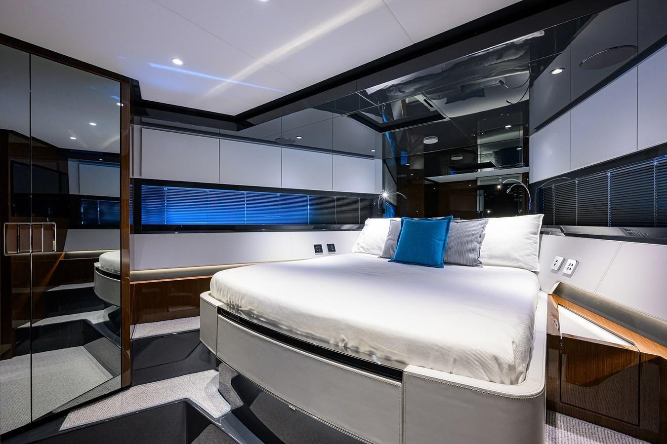 a room with a bed and a window aboard JACQPOT Yacht for Sale