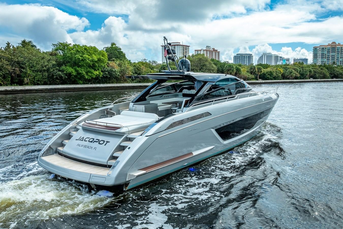 a white boat on water aboard JACQPOT Yacht for Sale