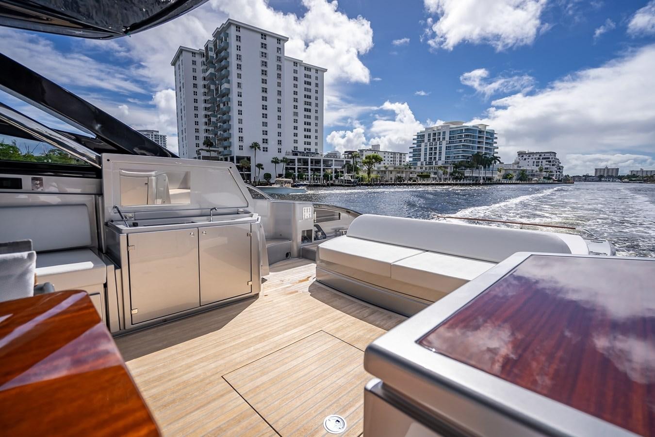 a room with a view of a city and a body of water aboard JACQPOT Yacht for Sale
