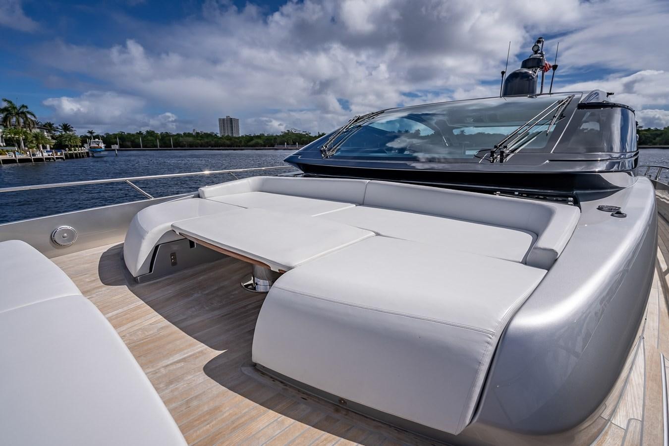 a white boat on a wooden deck aboard JACQPOT Yacht for Sale