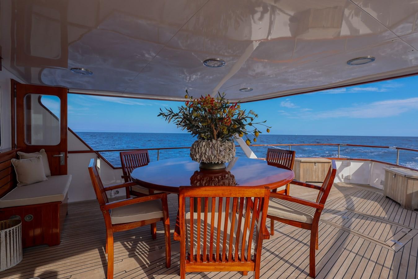 a table and chairs on a deck aboard SISSI Yacht for Sale