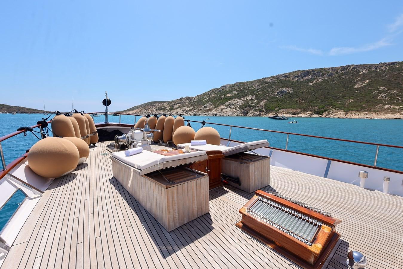 a deck with a large pool and a deck with a large round object on it aboard SISSI Yacht for Sale