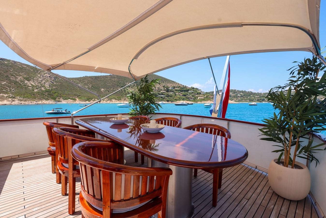 a table and chairs on a deck aboard SISSI Yacht for Sale