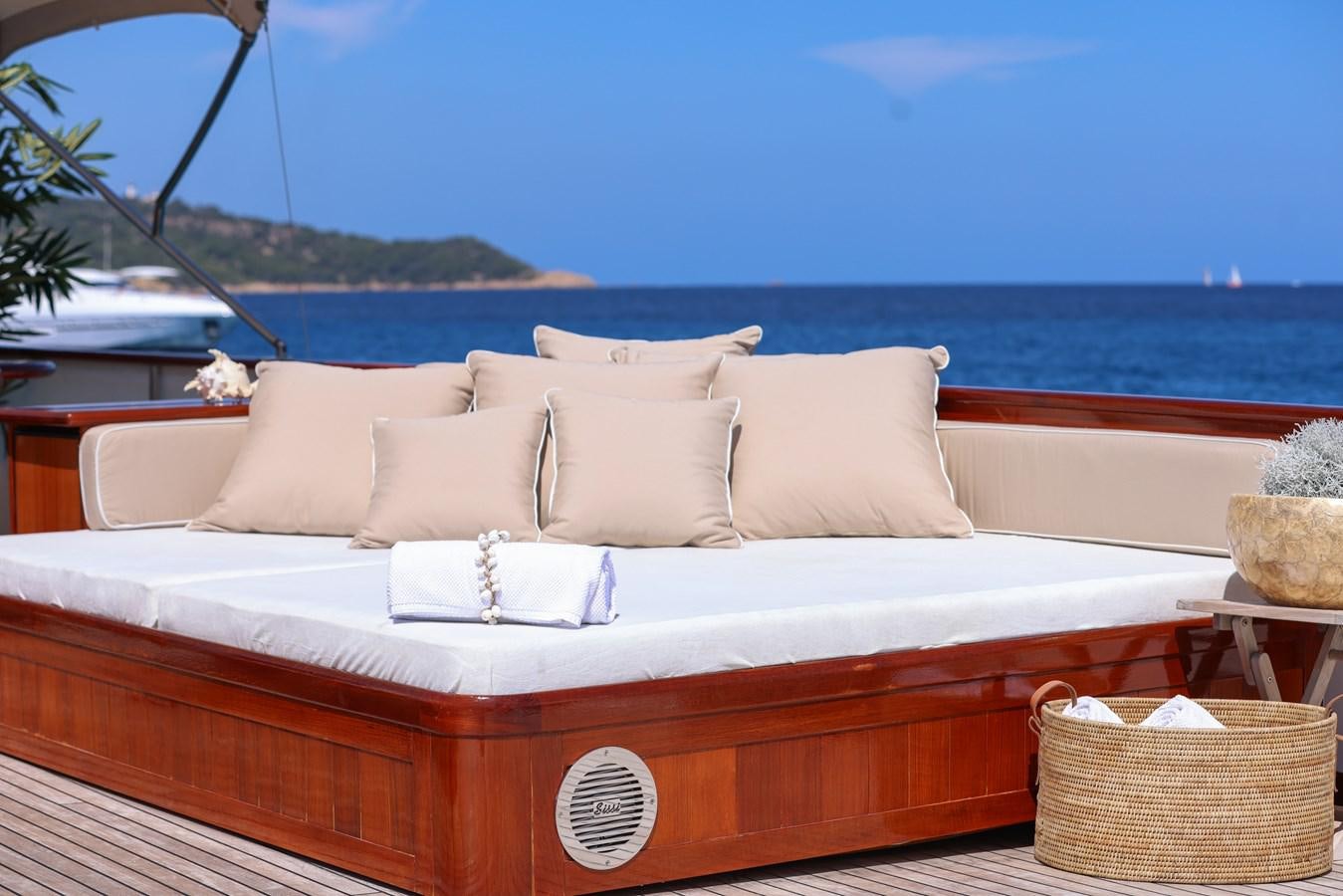 a white couch with pillows on it aboard SISSI Yacht for Sale