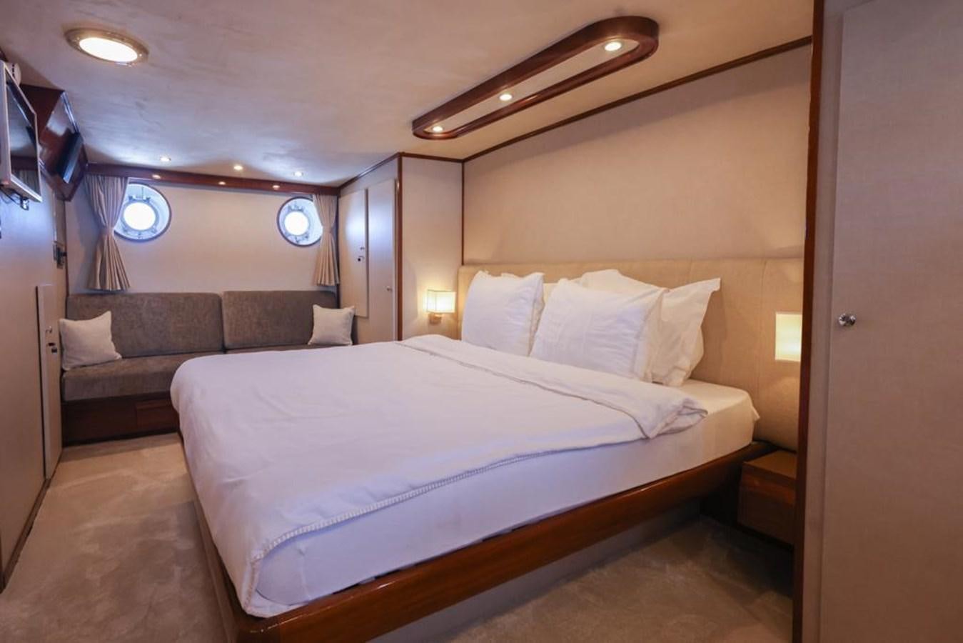 a bed in a room aboard SISSI Yacht for Sale