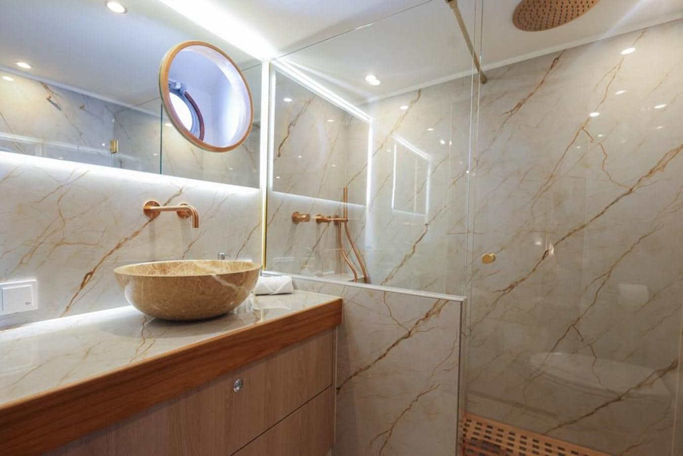 a bathroom with a sink and a mirror aboard SISSI Yacht for Sale