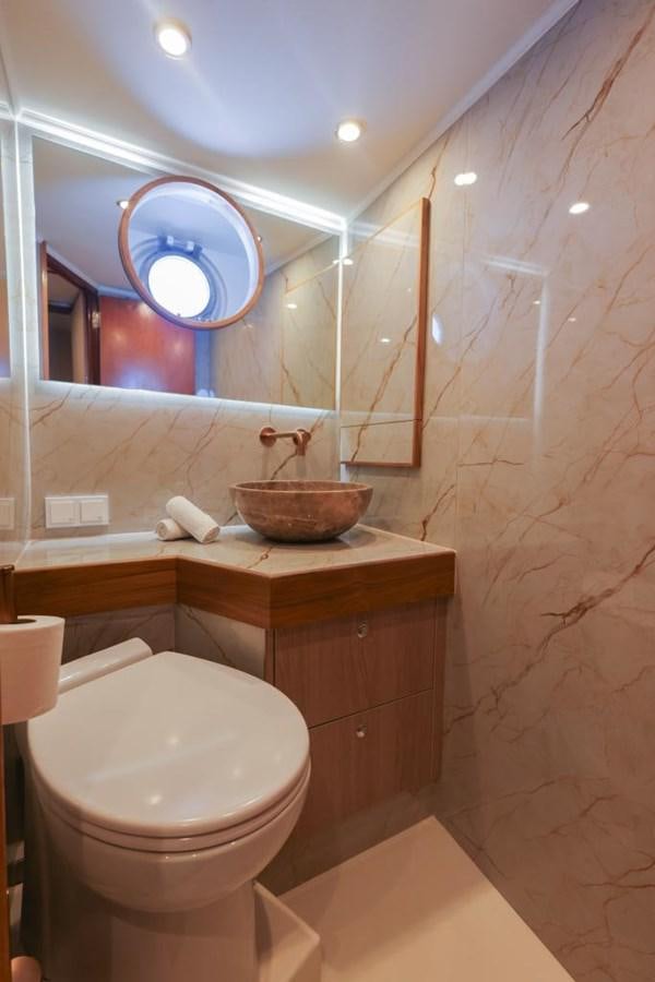 a bathroom with a toilet and a mirror aboard SISSI Yacht for Sale