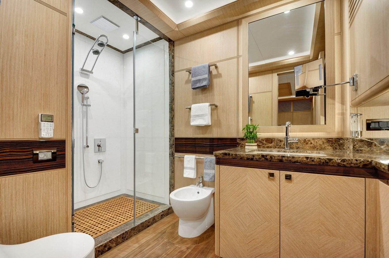 a bathroom with a glass shower aboard THAT'S AMORE Yacht for Sale