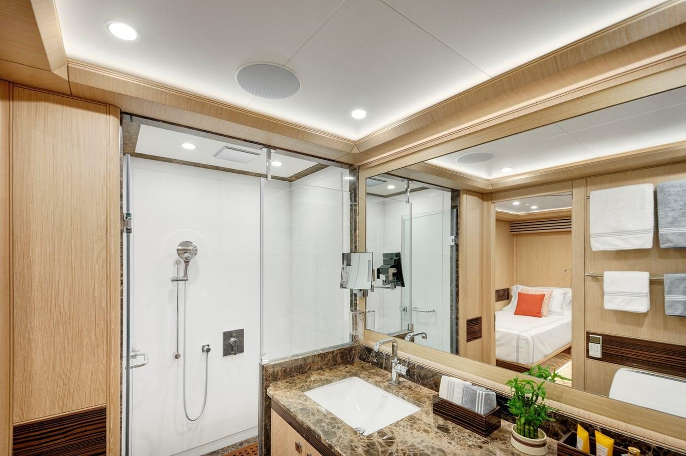 a bathroom with a large mirror aboard THAT'S AMORE Yacht for Sale