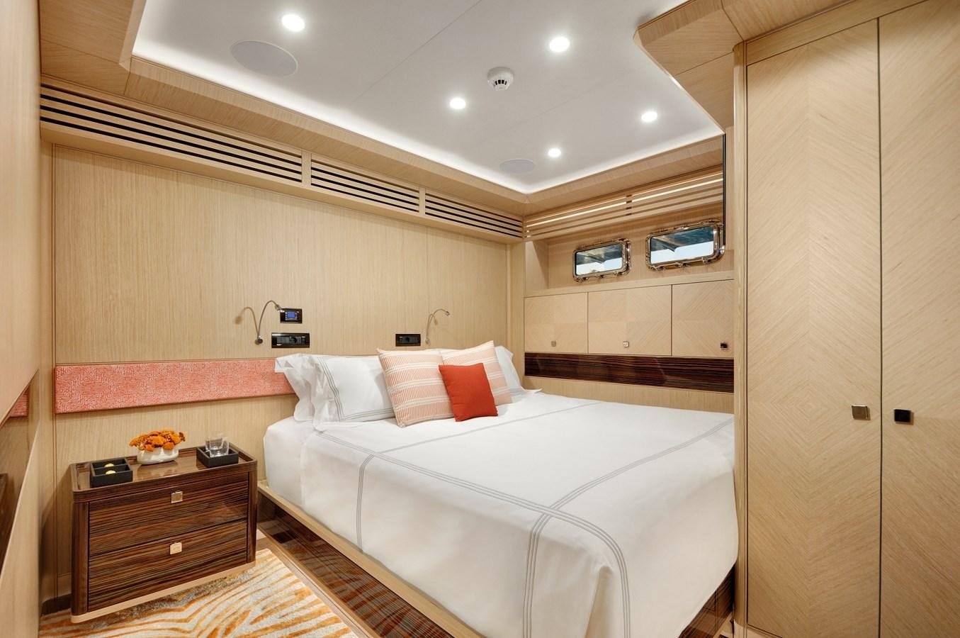 a room with a bed and a dresser aboard THAT'S AMORE Yacht for Sale