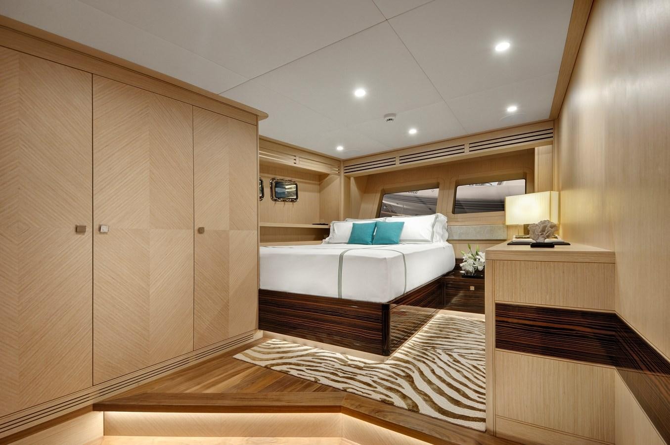 a room with a bed and a couch aboard THAT'S AMORE Yacht for Sale
