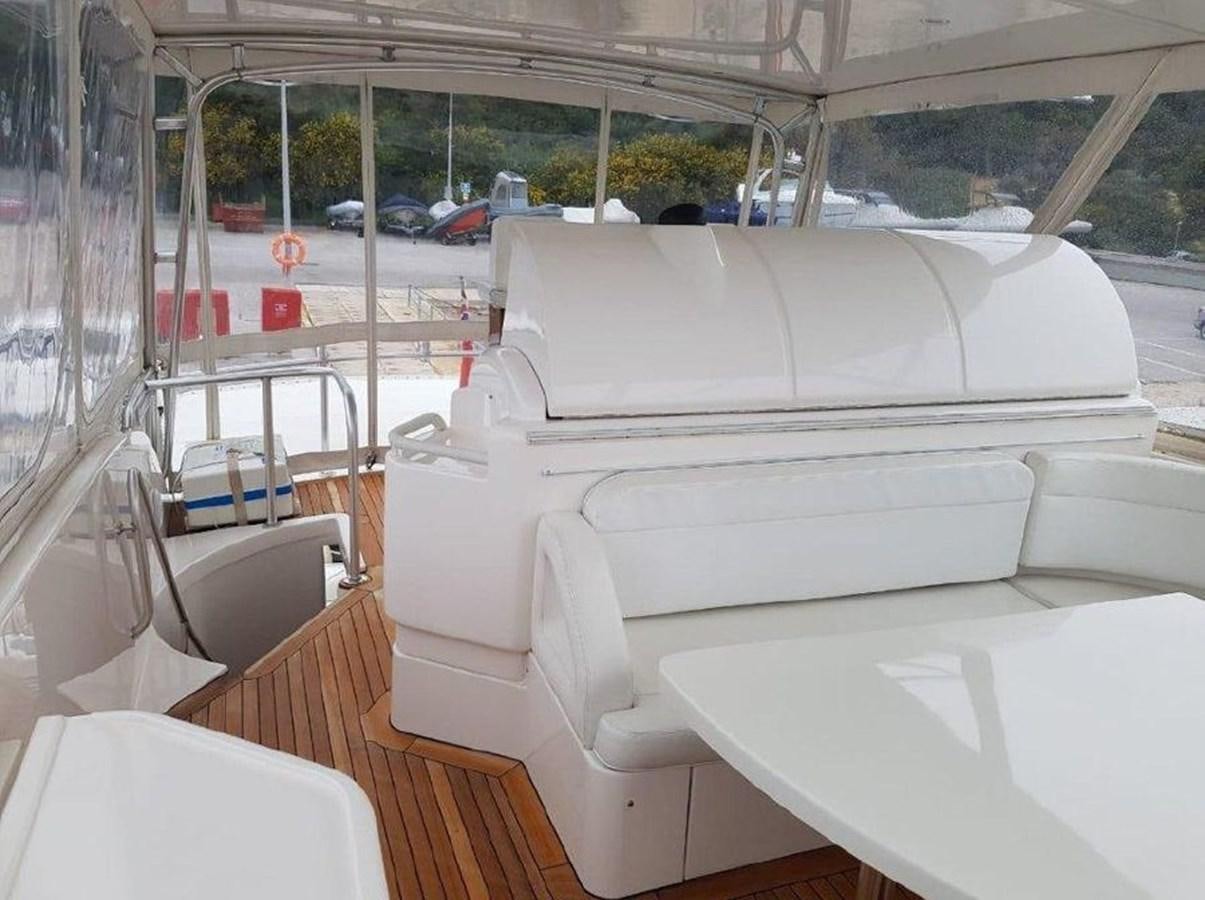 a white couch on a boat aboard BOUKI Yacht for Sale