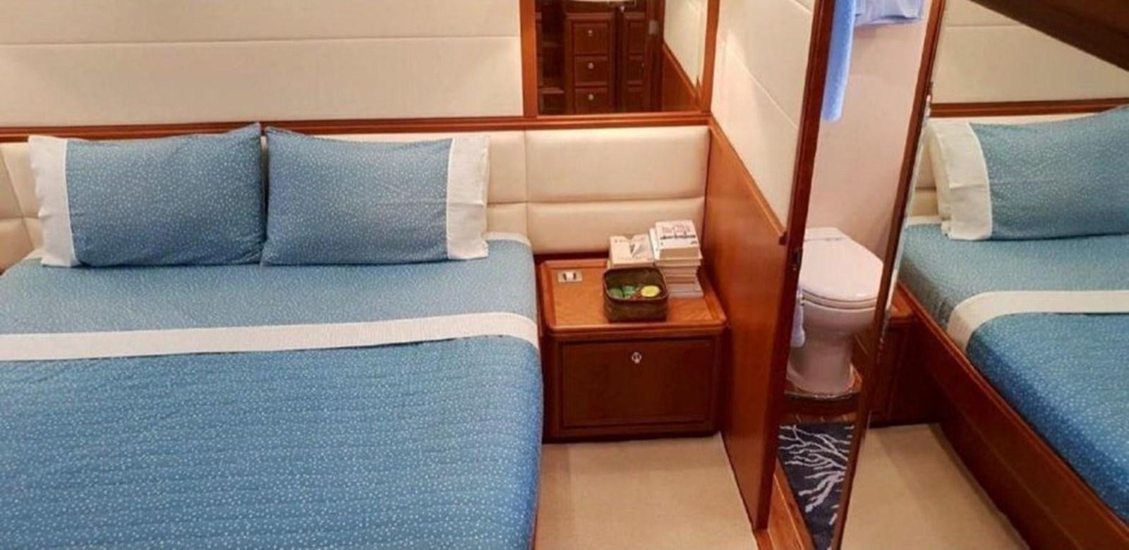 a room with a bed and a desk aboard BOUKI Yacht for Sale
