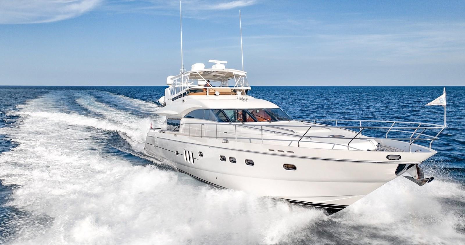 a white boat on the water aboard HALF MINE Yacht for Sale