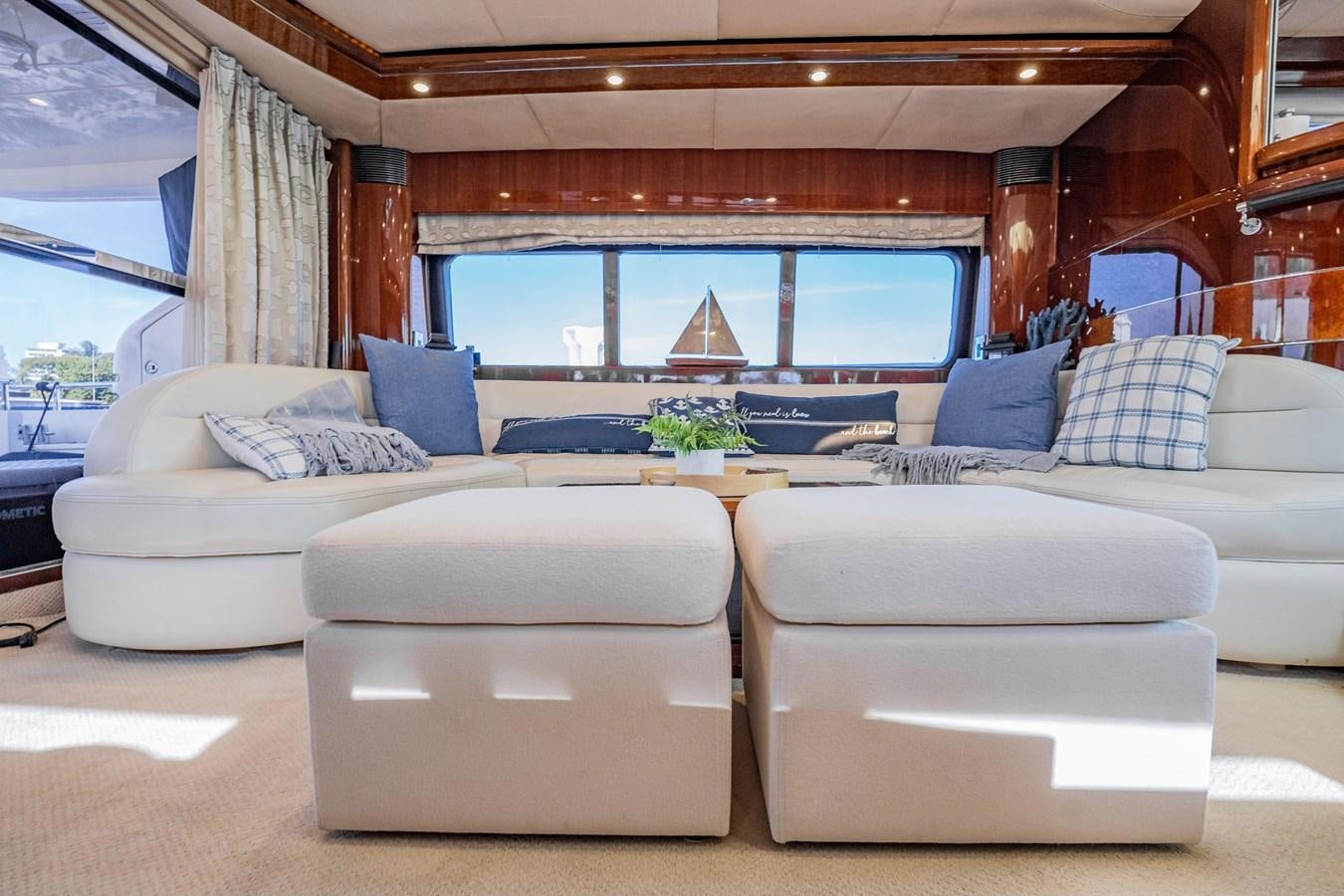 a living room with couches and a table aboard HALF MINE Yacht for Sale