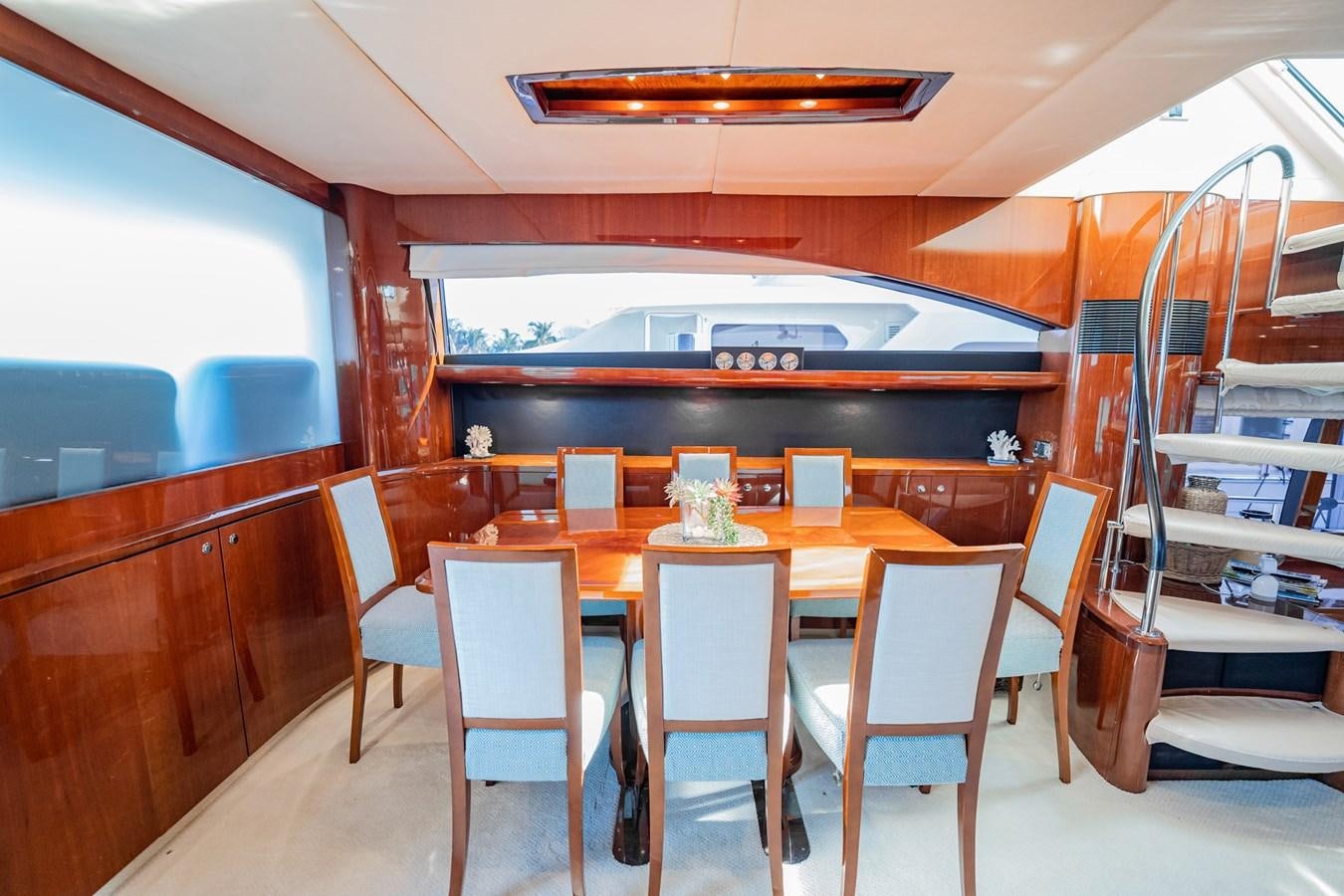 a dining table in a room aboard HALF MINE Yacht for Sale