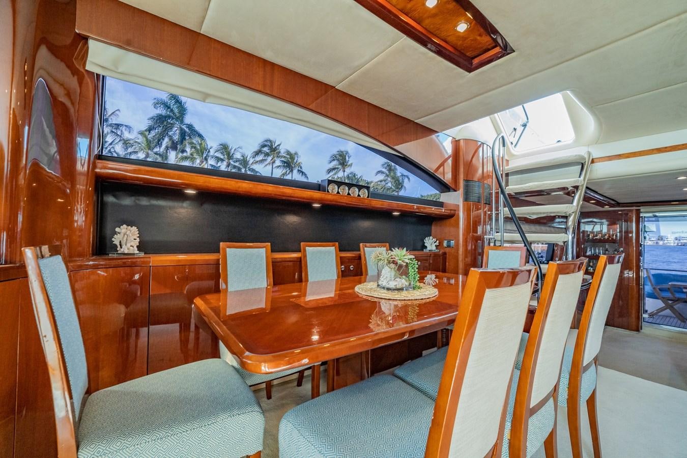 a dining table in a house aboard HALF MINE Yacht for Sale