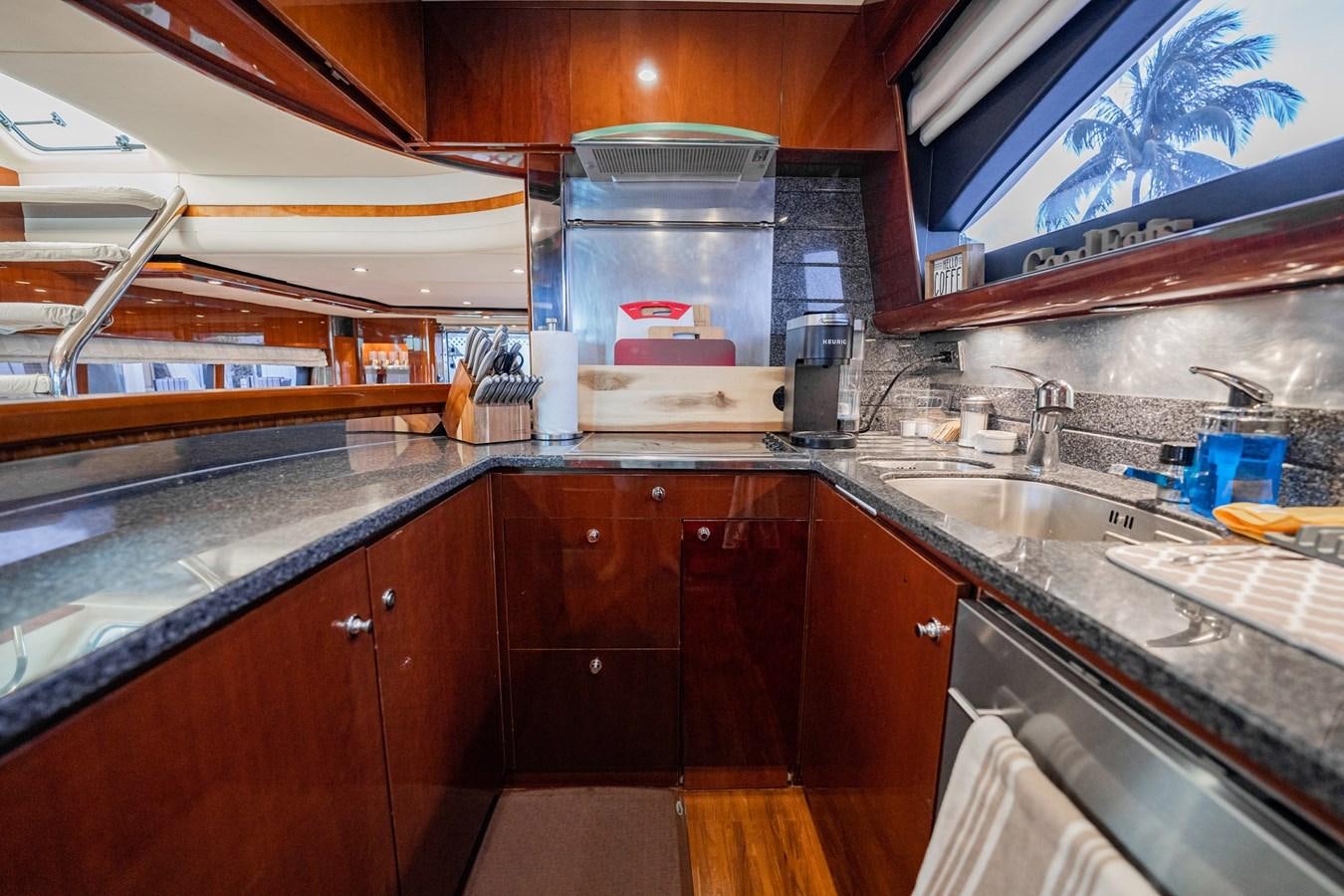 a kitchen with a glass wall aboard HALF MINE Yacht for Sale