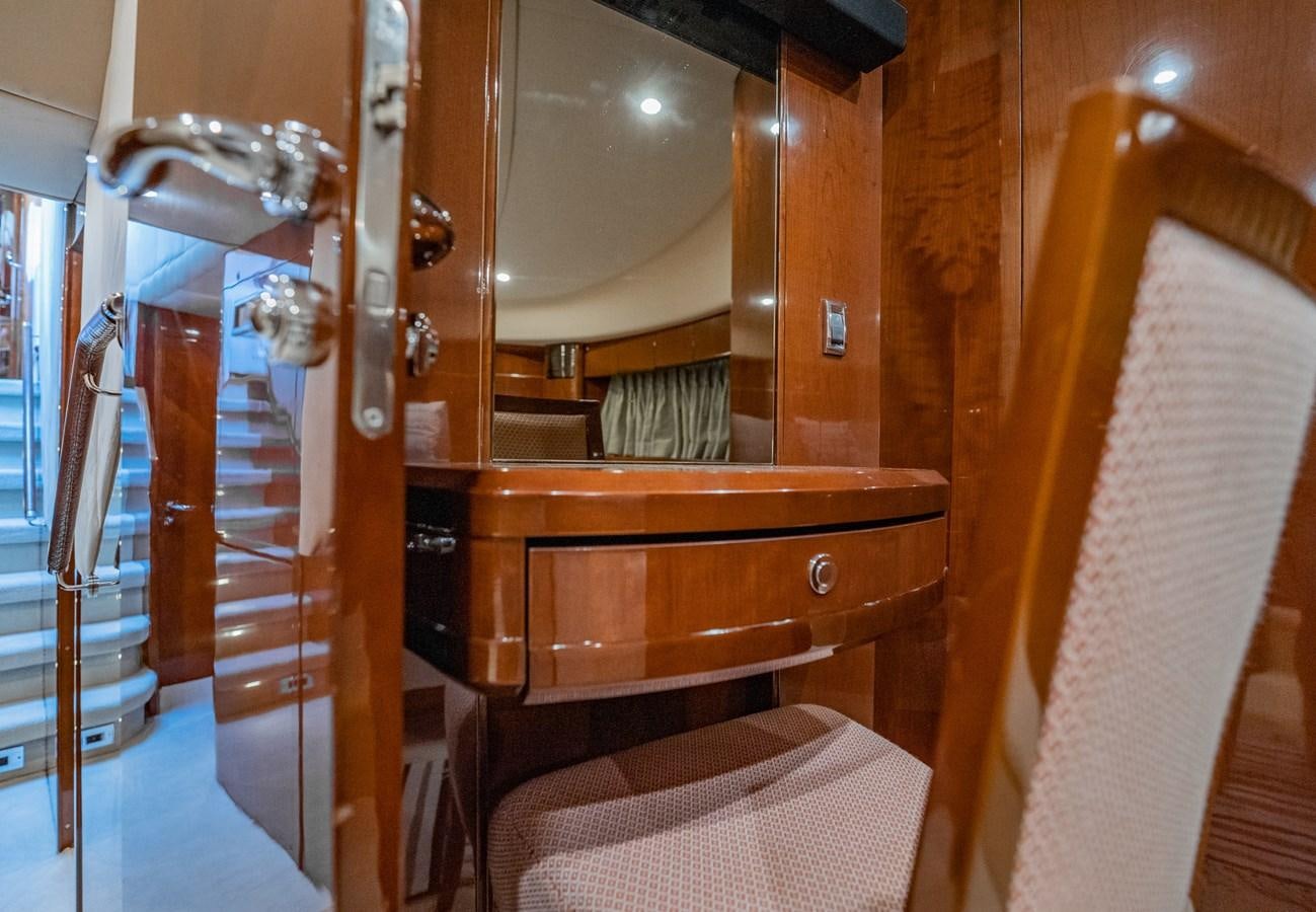 a wooden bed with a white sheet aboard HALF MINE Yacht for Sale