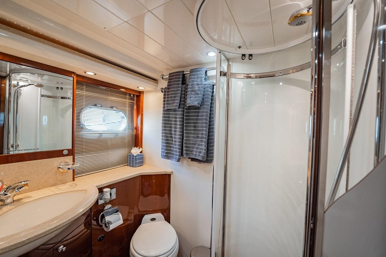 a bathroom with a sink and a mirror aboard HALF MINE Yacht for Sale