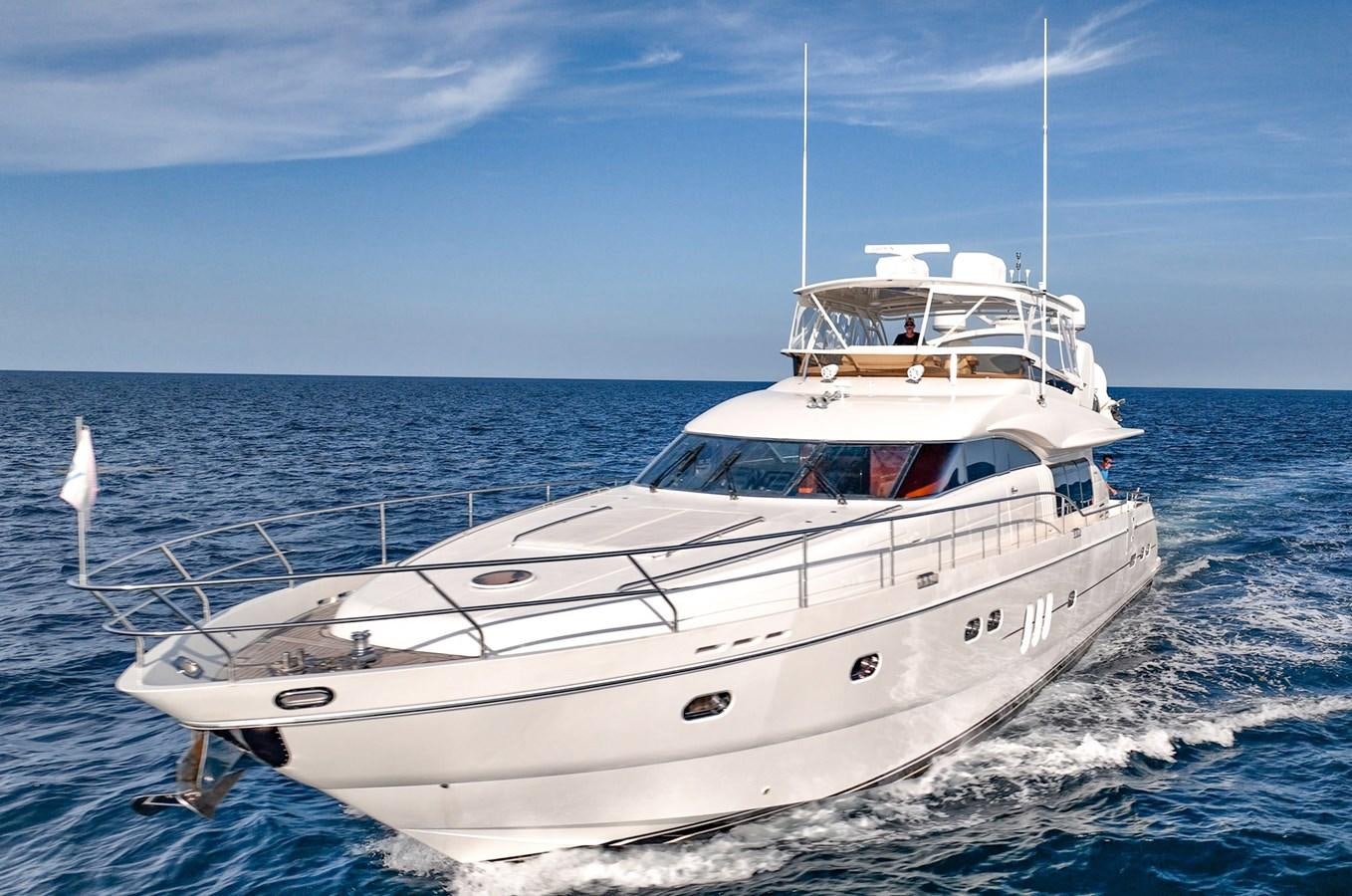 a white boat on the water aboard HALF MINE Yacht for Sale