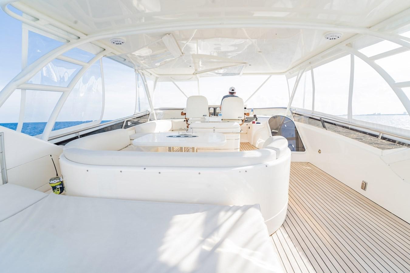 a white boat in a large room aboard HALF MINE Yacht for Sale