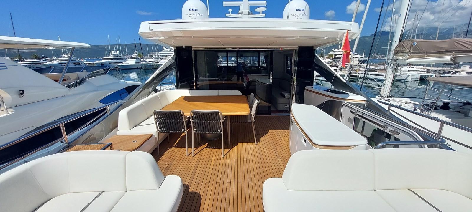 a boat with tables and chairs aboard PERLA Yacht for Sale