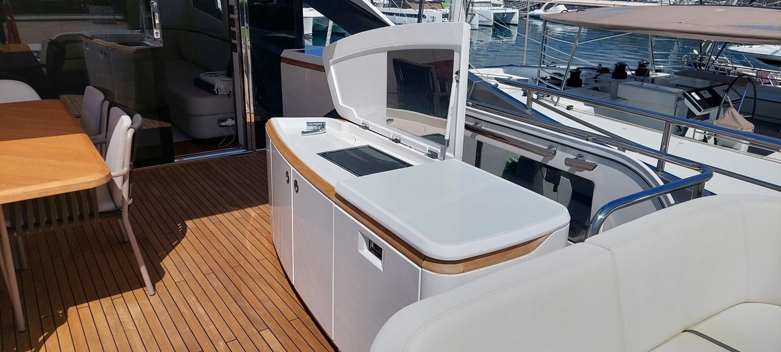 a boat with a desk and chairs aboard PERLA Yacht for Sale