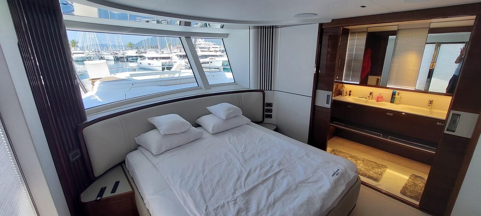 a room with a bed and a window aboard PERLA Yacht for Sale