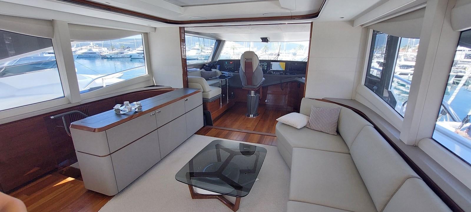 a room with a couch and a table aboard PERLA Yacht for Sale