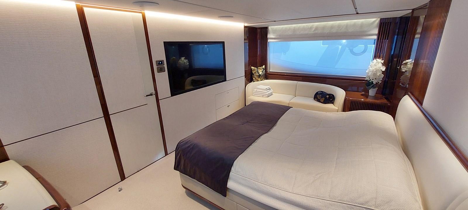 a room with a bed and a tv aboard PERLA Yacht for Sale