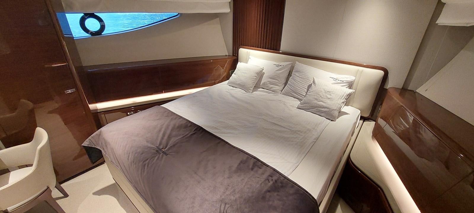 a bed with white sheets aboard PERLA Yacht for Sale
