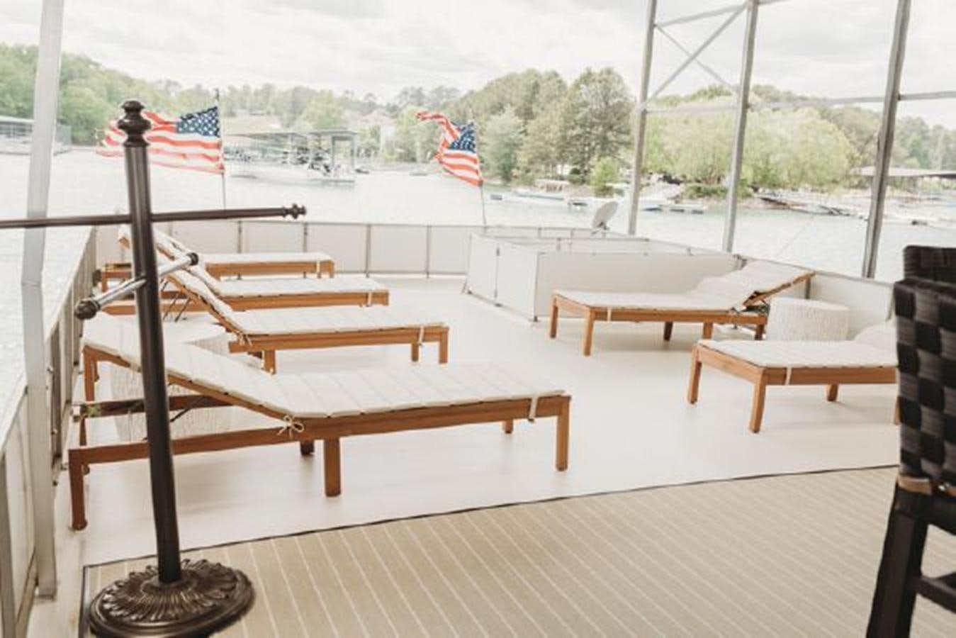 a table and chairs on a deck aboard 88 LAZY DAYS BEACHEM Yacht for Sale