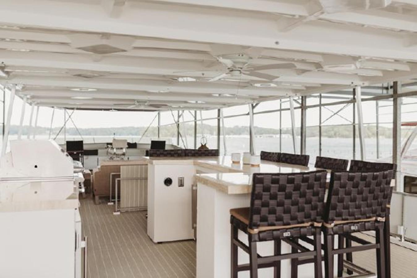 a room with chairs and tables aboard 88 LAZY DAYS BEACHEM Yacht for Sale