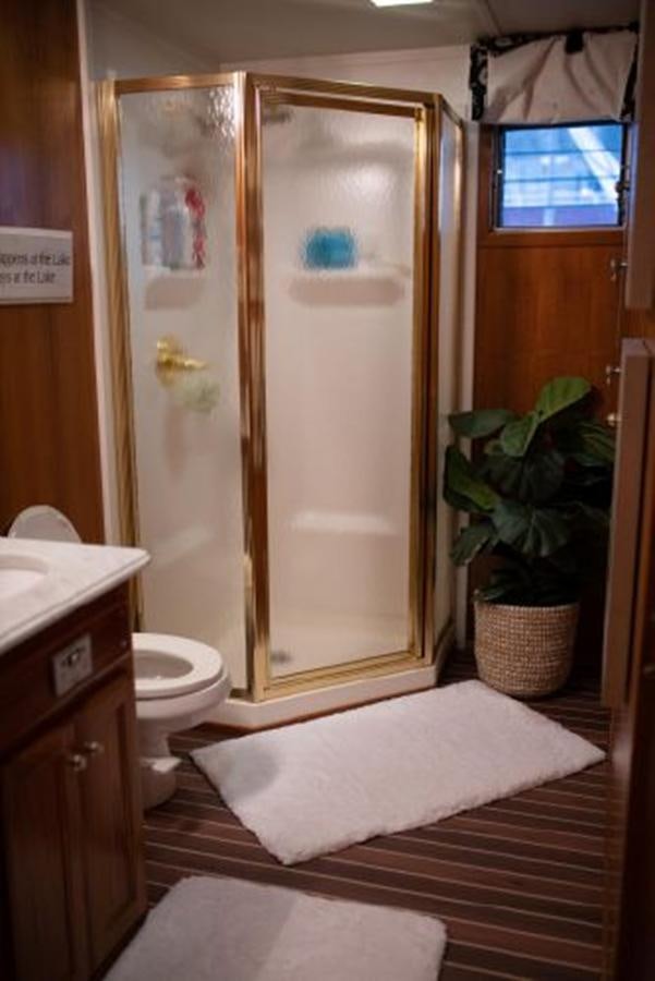 a bathroom with a shower unit and a toilet aboard 88 LAZY DAYS BEACHEM Yacht for Sale