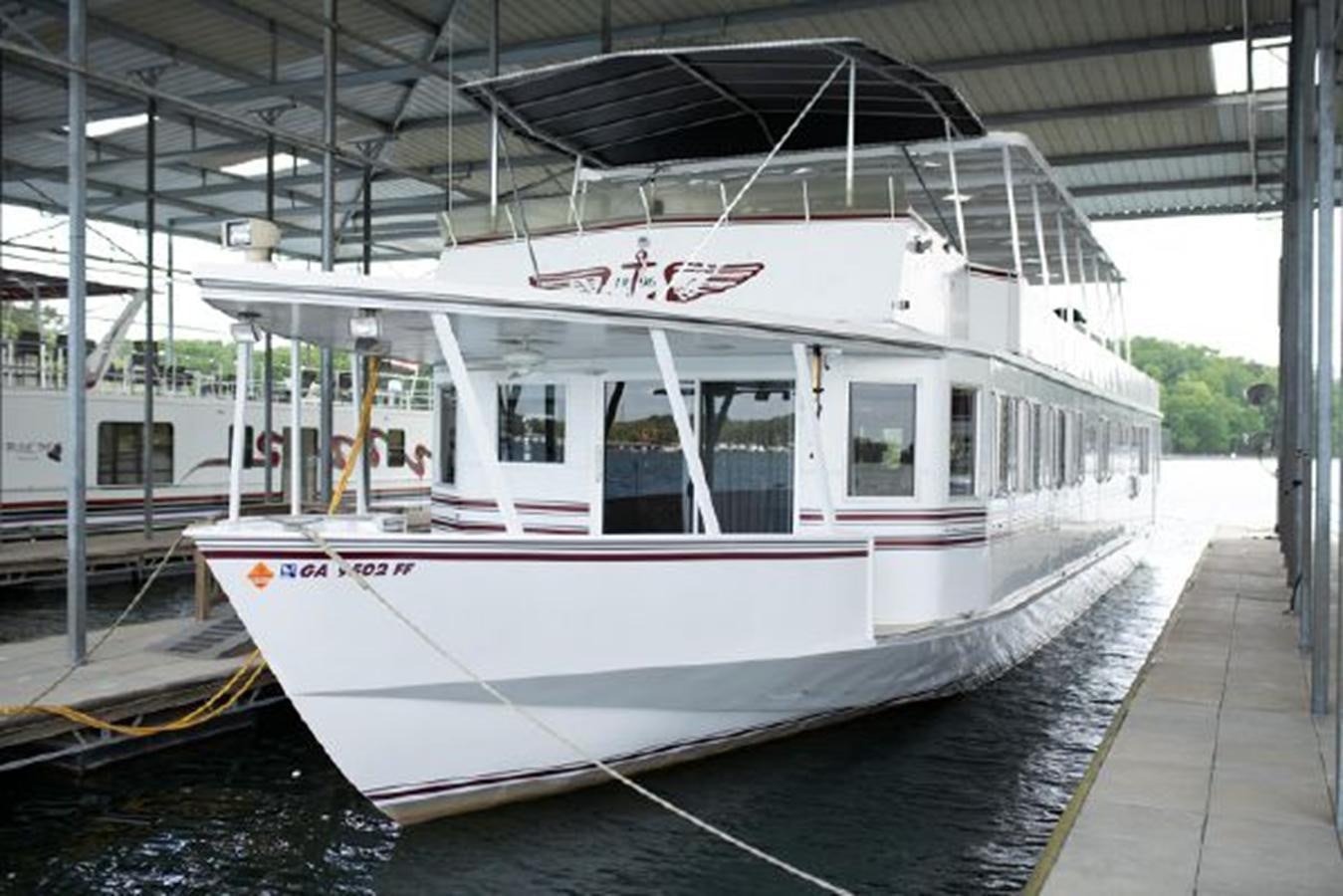 a white and red boat aboard 88 LAZY DAYS BEACHEM Yacht for Sale
