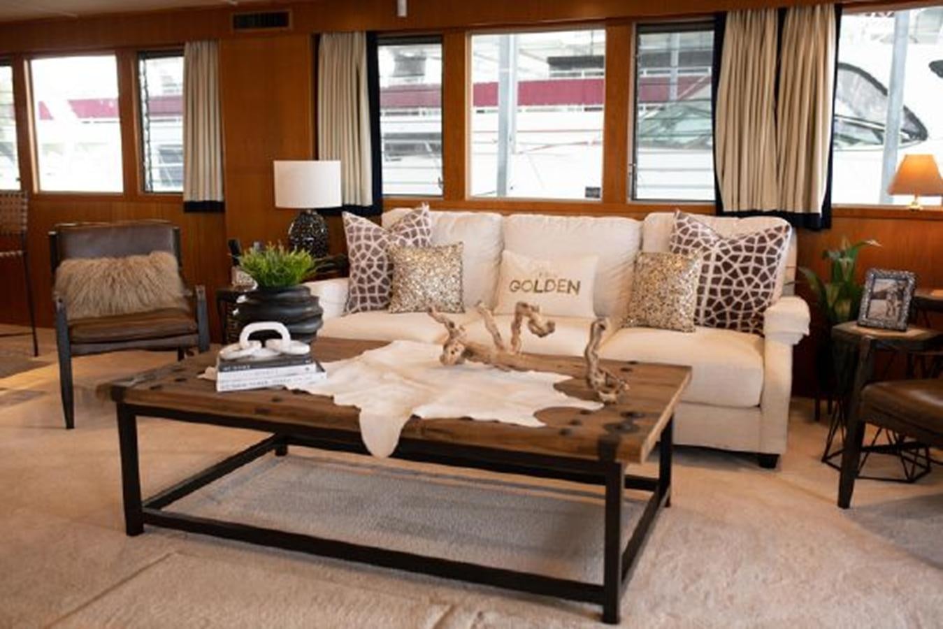 a living room with a couch and coffee table aboard 88 LAZY DAYS BEACHEM Yacht for Sale