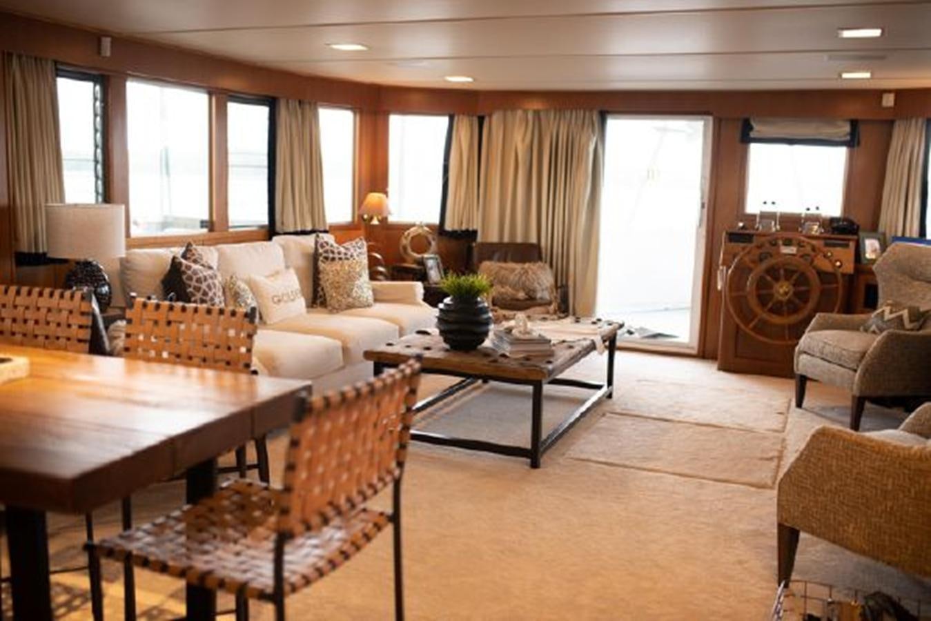 a living room with a table and chairs aboard 88 LAZY DAYS BEACHEM Yacht for Sale