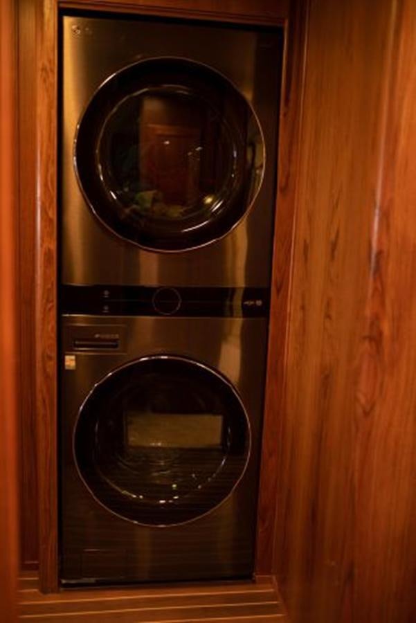 a black rectangular object with a silver face on a wooden surface aboard 88 LAZY DAYS BEACHEM Yacht for Sale