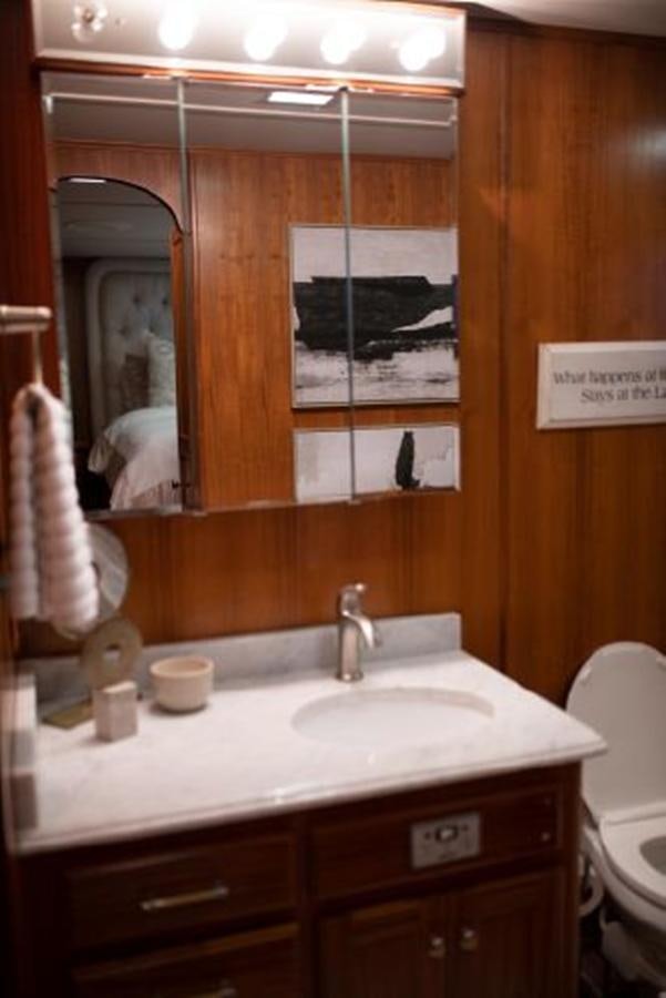 a bathroom with a sink and mirror aboard 88 LAZY DAYS BEACHEM Yacht for Sale