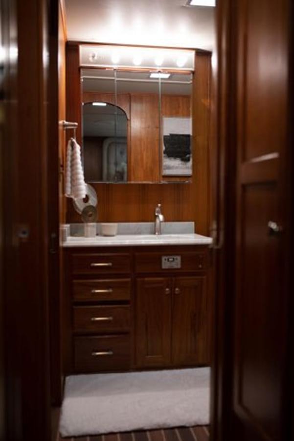 a bathroom with a sink and a mirror aboard 88 LAZY DAYS BEACHEM Yacht for Sale
