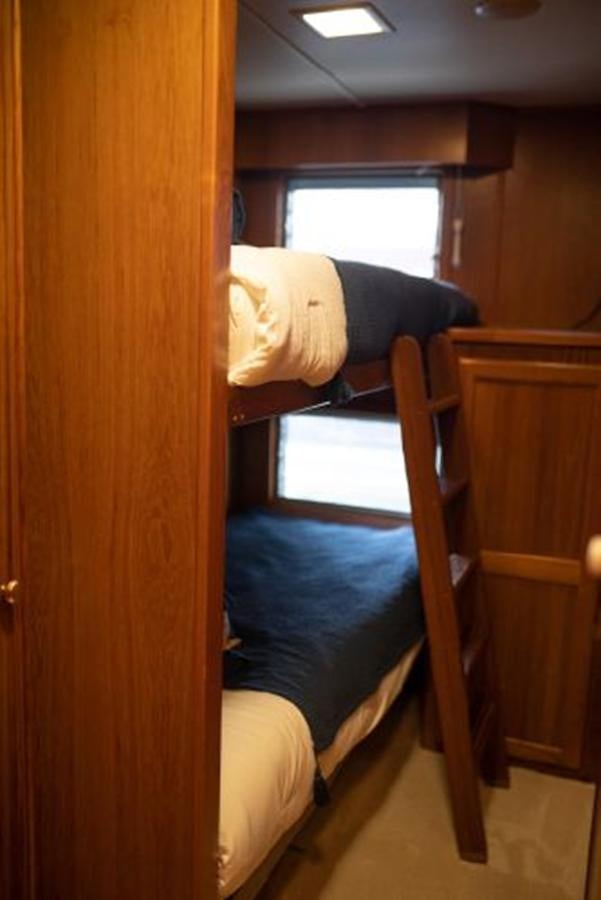 a bunk bed with a blue sheet aboard 88 LAZY DAYS BEACHEM Yacht for Sale